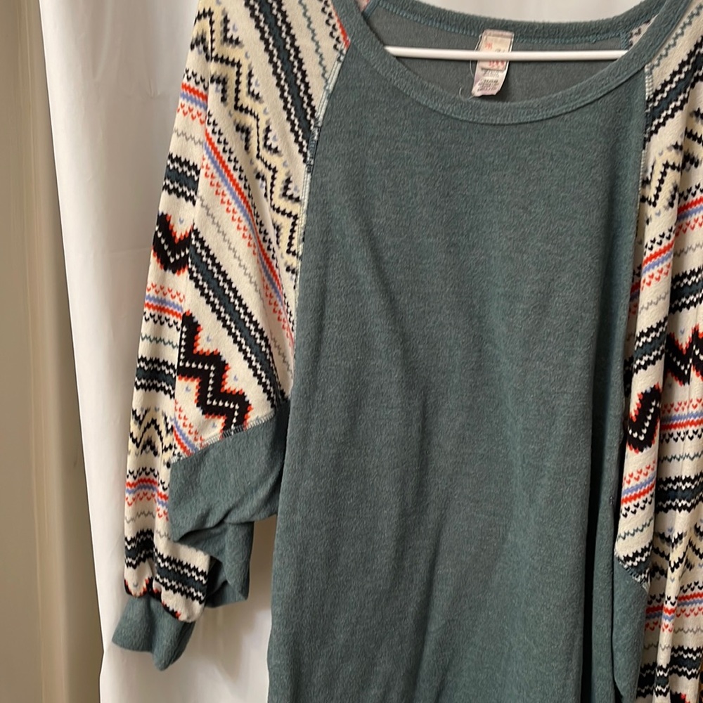 Women’s long sleeve knit top with bell sleeves